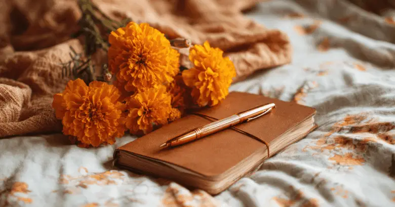 Journal, Pen, and Orange Flowers